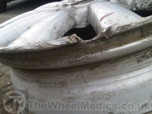 002. Alloy Wheel needs rebuilding as a chunk of Aluminium is missing
