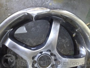 002. Subaru Buckled and Bent Alloy Dish. Before Fitting New Dish.