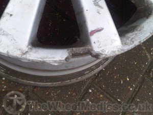 003. Alloy Wheel needs rebuilding as a chunk of Aluminium is missing